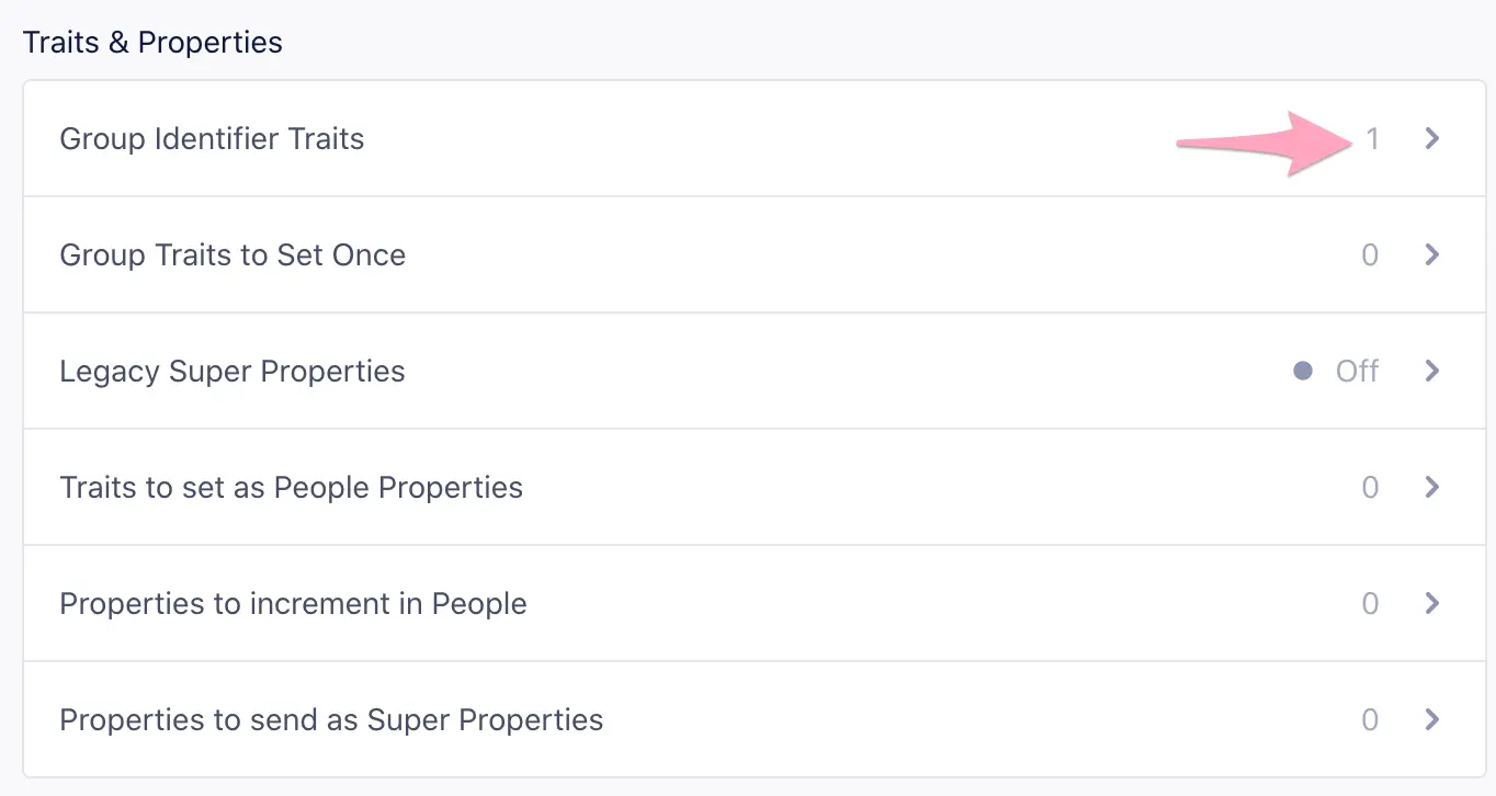 The Mixpanel Traits and Properties list showing the 'Group Identifier Traits' field where one or more traits (like company_id) can be defined for grouping users.